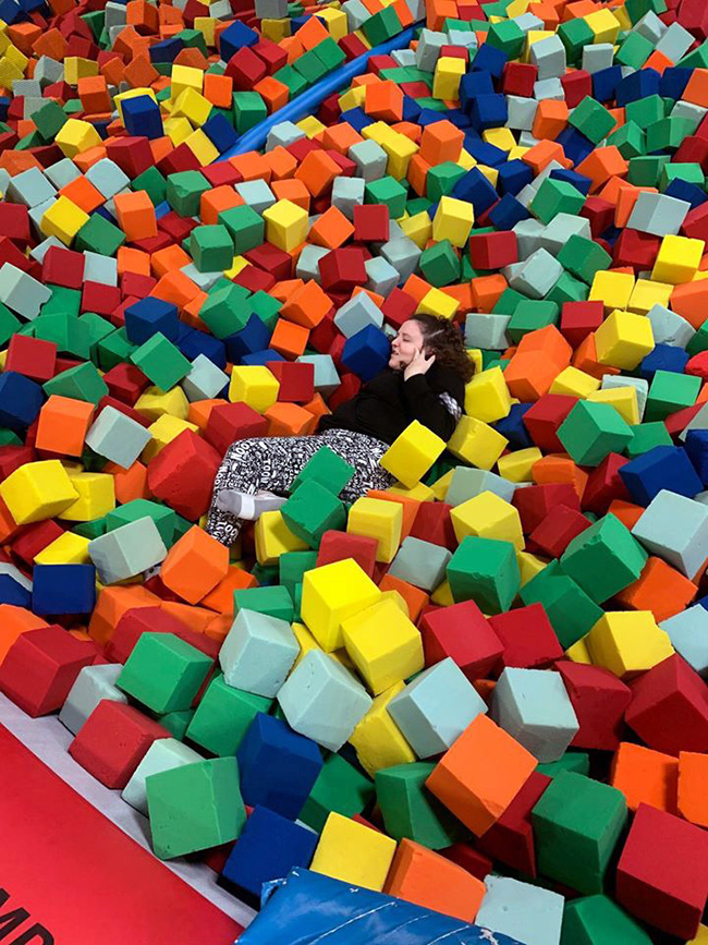 Above left: Heather Hoffman after taking a dive into the sponge balls.